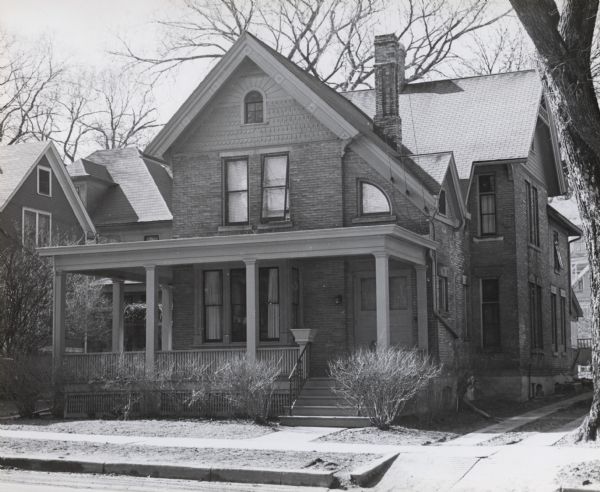 The Mack house, 110 East Johnson Street, showing the front and east wall of the house.  Built by A.C. Isaac around 1870, it was later the residence of Professor John G.D. Mack and family, and was owned in 1953 by J.P. Cafferty.