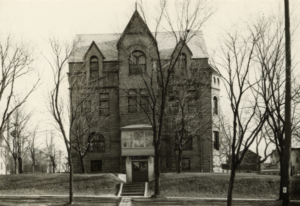 The building at 309 West Washington Avenue was built in 1891 for the St. Regina Convent and Academy of the Sinsinawa Dominican nuns across the street from the St. Raphael’s School at which they taught. The three lots on which it was built previously had houses, one of which had been built around 1865 and had previously served as a hotel. The Academy moved to a new building at the Edgewood campus built in 1894. The West Washington Avenue convent building was later acquired by the Wisconsin Methodist Hospital and Homes Association for a 40 bed hospital in March 1920. After the hospital built a new building it became Maude Sager Hall, a dormitory and school for Methodist Hospital student nurses. It was torn down in 1960.