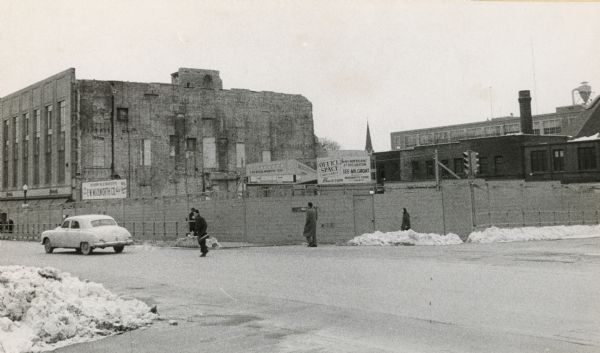 The intersection of Mifflin Street and Wisconsin Avenue after the old City Hall (1858-1954) and Fuller Opera House had been torn down.