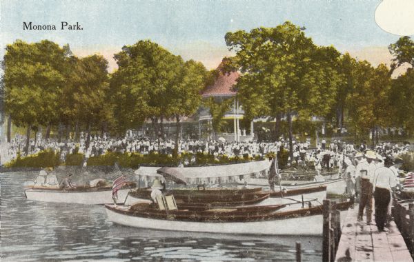 View of boaters and crowds at Monona Park. Caption reads: "Monona Park."