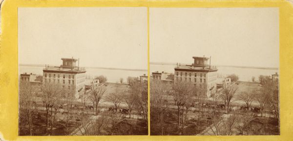 Stereograph of an elevated view of the Vilas House hotel, East Main Street at Monona Avenue.
