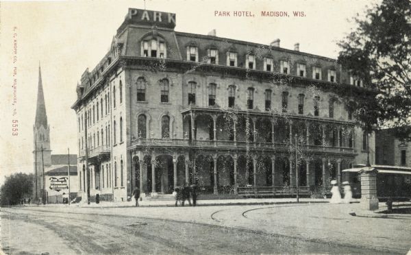 View across intersection towards the Park Hotel, located on the Capitol Square. Caption reads: "Park Hotel, Madison, Wis."