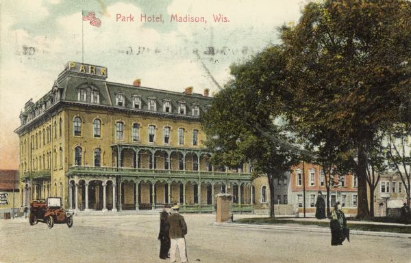 View across intersection towards the Park Hotel, located on the Capitol Square. Caption reads: "Park Hotel, Madison, Wis."
