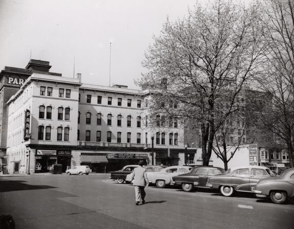 View of the corner of Carroll and West Main Streets downtown. The Park Hotel occupies the large building. The Prescription Pharmacy, the Park Hotel Barber Shop, and the Hob Nob Bar also occupied space on the first floor.