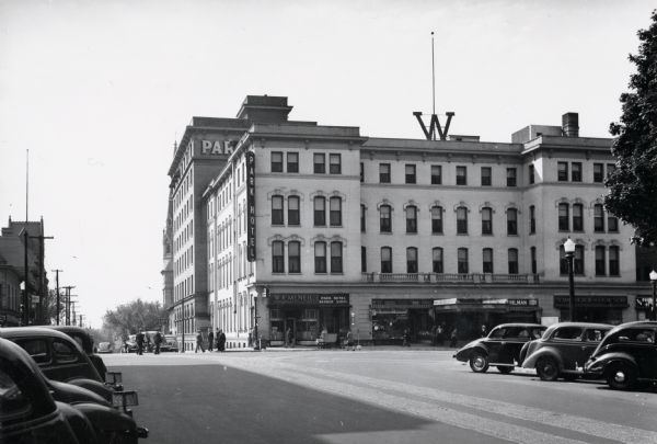 View down Main Street towards the Park Hotel at the corner of Carroll and Main Streets. Located on the first floor of the hotel is The Park Hotel Barber Shop.