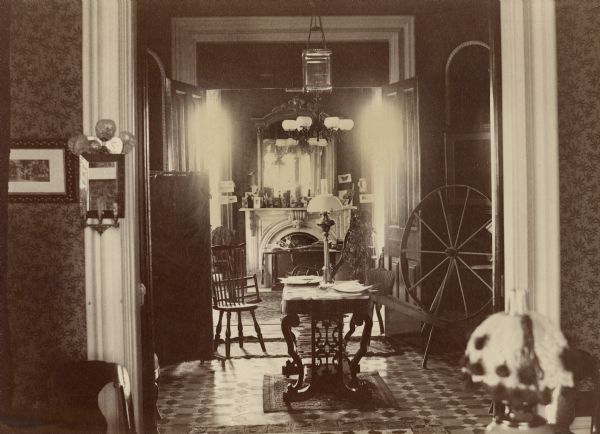 An interior look at the so-called Pierce home, located at 424 North Pinckney Street, at the corner of Pinckney and Gilman Streets. At the time this photograph was taken, the home was the residence of Sarah Fairchild Dean Conover (Mrs. Obadiah M.).