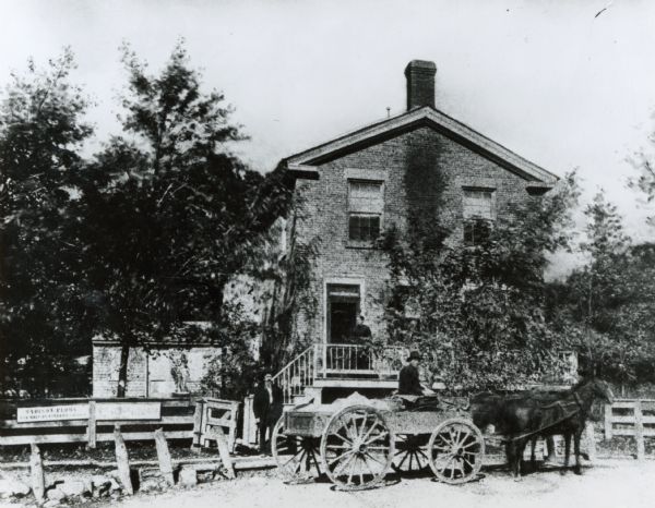 Exterior of Plow (Plough) Inn, located at 3402 Monroe Street. An early view of the tavern which derived its name from the Fuller & Johnson plows for sale on the premises when John Whare and his wife Isabella lived there.  
