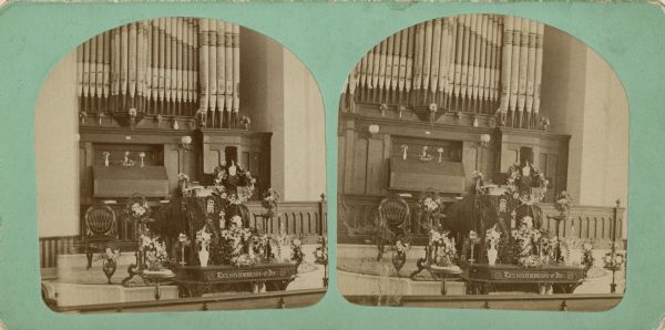 Stereograph of the interior of the Presbyterian church decorated for the funeral of Mrs. George Smith.
