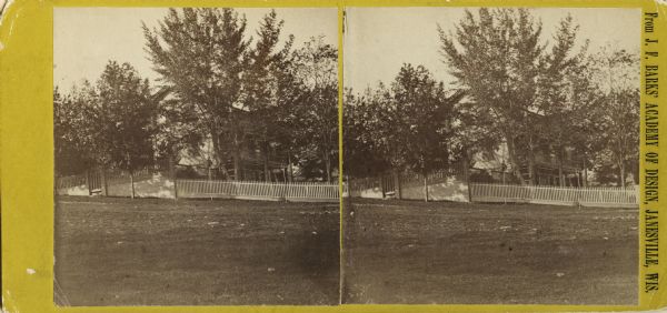 Stereograph of the Rublee house, among trees. The residence of Horace Rublee, formerly owned by J.A Ellis, on the east corner of Wisconsin Avenue and Gilman Street.