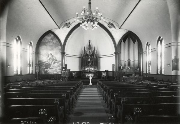 An interior view of St. John's Lutheran Church, looking from the back of the church towards the altar, at 320-322 East Washington Avenue.