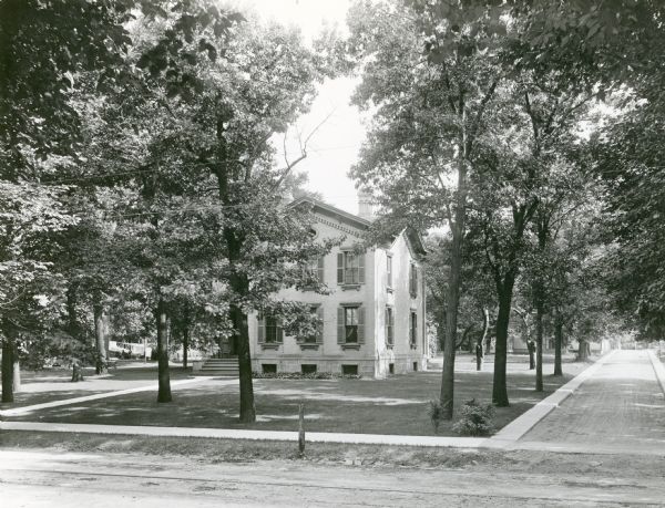 View of Prof. John W. & Harriet Dean Sterling House and its large yard located at the southeast corner of 811 State Street and Sterling Court. Built in 1870, torn down in 1922. Replaced by Phi Psi fraternity house facing Sterling Court.