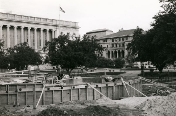 View of State Street Mall under construction. Visible in the background to the left is the Wisconsin State Historical Society and to the right, the Wisconsin Memorial Union.