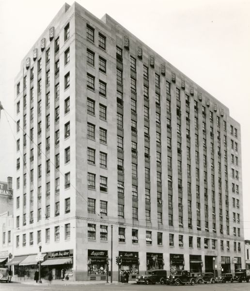 An exterior view of the Tenney Building, located at the corner of Pinckney and Main Streets on Capitol Square. Liggett's Drugstore occupies the first floor of the building.