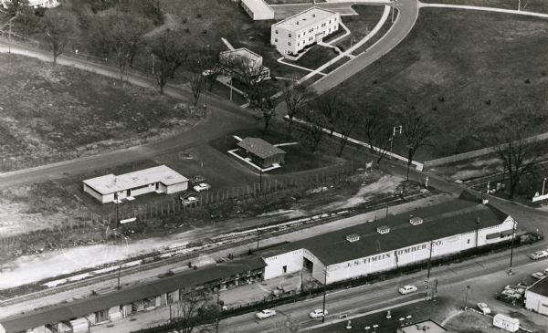Aerial view of University Avenue near the Veteran's Administration Hospital. At the bottom is the J.S. Timlin Lumber Company.