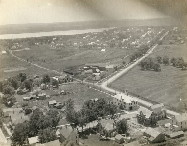 Aerial view looking toward Lake Wingra. In the foreground is the Yawkey-Crowley Lumber Yard. The company built it's warehouse at 1542 Monroe Street between 1908-1909.