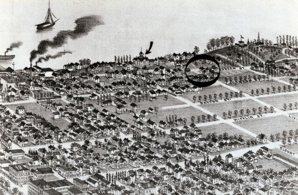 A depiction of the near east side of Madison circa 1885. The arrow indicates the location of the old Second Ward Grammar School and the circle shows the area in which the family of Frank Lloyd Wright lived at about this time.