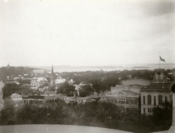 View from the Wisconsin State Capitol dome looking west towards Bascom Hill. Mifflin street with City Hall and the Fuller Opera House are in the foreground. Lake Mendota and Picnic Point are in the background.