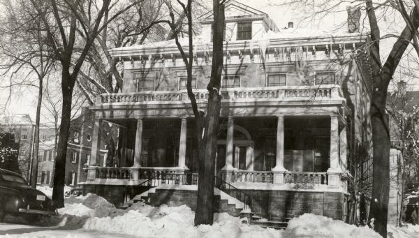 An exterior view of the Levi B. Vilas mansion at the corner of Henry and Langdon Streets. Built about 1850, it later became a fraternity house for Phi Gamma Delta and then Sigma Phi Epsilon fraternities. The house was razed in 1965.