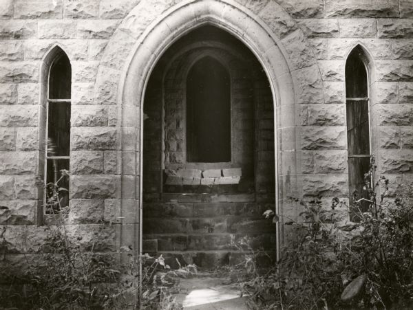 An exterior view of the rear doorway to the Banjamin Walker Castle, 1862-1893 in the 900 block of East Gorham Street.