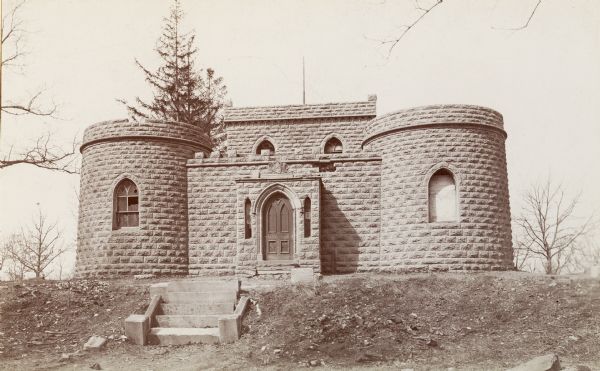 Benjamin Walker Castle, 1862-1893 in the 900 block of East Gorham Street. Above the doorway is a carved decoration of a shield and the words: "Semper Paratus".