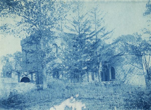 A cyanotype print of the Benjamin Walker Castle, 1862-1893 in the 900 block East Gorham Street, and the surrounding estate.