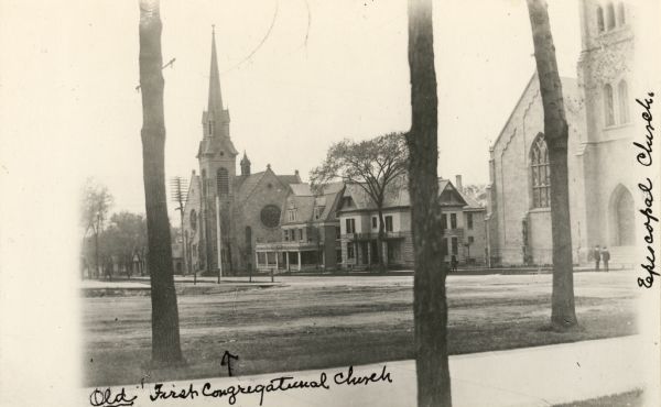 View of West Washington Avenue from the Capitol grounds. On the right is the Episcopal Church and on the far left, the First Congregational Church. The building to the left of the Episcopal Church parsonage was the Harndon Club, a private club where families often took their Sunday dinner following church services.
