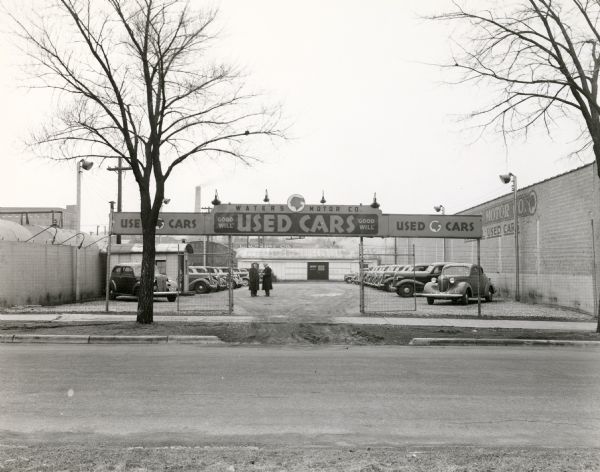 View across street towards the Waters Motor Company Used Car Sales Lot, located at 746 East Washington Avenue.