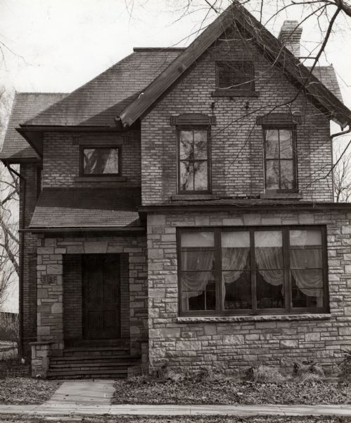 Exterior view of the Gallagher residence, a large brick house, located at 515 West Wilson Street.