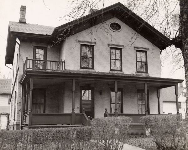 The Theodore Wilson residence, a brick house with a large porch, at 504 West Wilson Street.