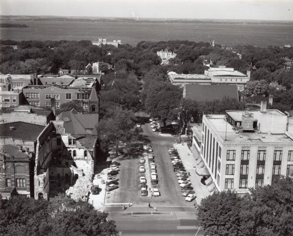 Elevated view of Wisconsin Avenue from the Wisconsin State Capitol balcony. At the lower left, the demolition of old City Hall is in progress, which began on August 31, 1954.