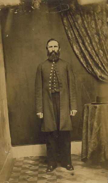A carte-de-visite portrait of Jacob Brant of Brodhead, Wisconsin, a member of the 1st Brigade, 3rd Division, 15th Army Corps Band.  Mustered out July 8th, 1865.