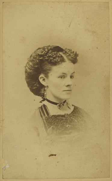 Vignetted quarter-length carte-de-visite portrait of Mrs. Ada Kimberley of Brodhead, Wisconsin.