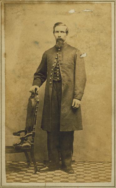 Carte-de-visite portrait of Frederick Knickerbocker of Shullsburg, Wisconsin, a member of the 1st Brigade, 3rd Division, 15th Army Corps Band. Mustered out July 8th, 1865.