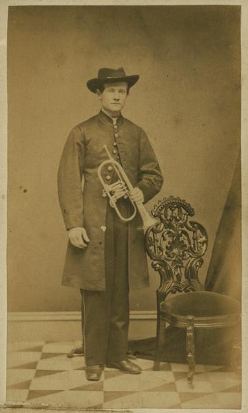 A carte-de-visite portrait of William S. Douglas of Shullsburg, Wisconsin, a member of the 1st Brigade, 3rd Division, 15th Army Corps band.  Mustered out July 8th, 1865.