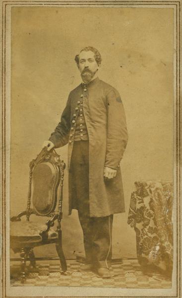 Full-length carte-de-visite portrait of Edward G. Kneeland of Shullsburg, Wisconsin, a member of the 1st Brigade, 3rd Division, 15th Army Corps Band.