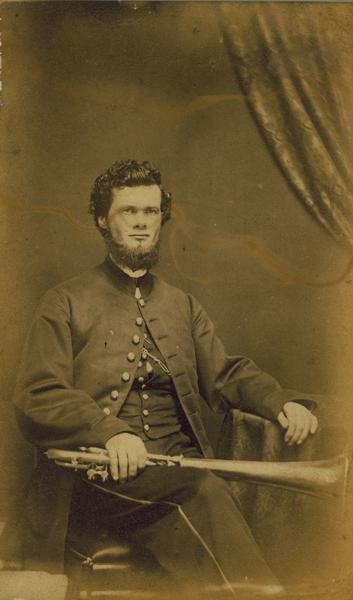 A carte-de-visite portrait of Theodore Pomeroy of Decatur, Wisconsin, a member of the 1st Brigade, 3rd Division, 15th Army Corps Band. Mustered out July 8th, 1865.
