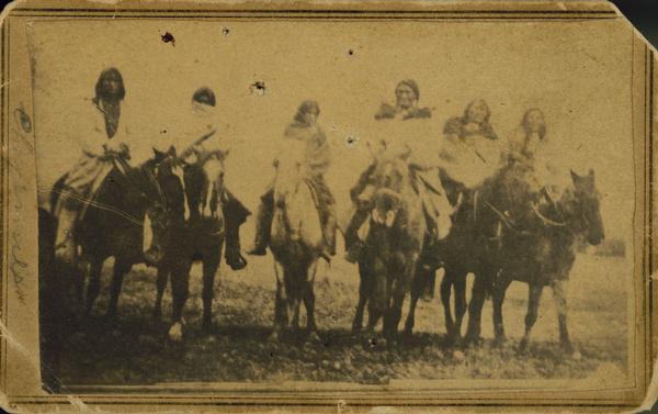 Six Cheyenne men on horseback.