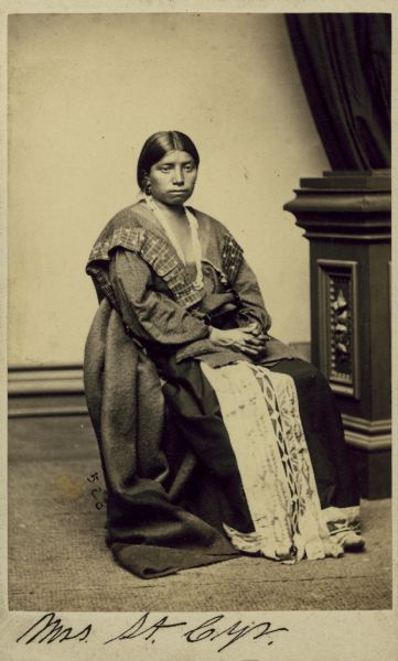 Portrait of Mrs. Alexander (Elick) St. Cyr, of the Sioux tribe. The text on the back reads: "Mrs. Alexander (Elick) St. Cyr. She came back to Wisconsin, has been dead some time." -- Oliver Lemere, 1926.