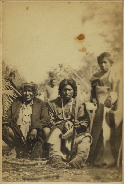 Portrait of three unidentified Native Americans.