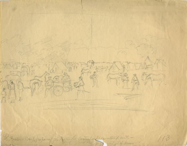 "Lieutenant Foster's Camp preparing for the night contrabands with the Engineer, Dept. of the Army". Tents are in the background and men are loading horse-drawn wagons with bundles in the foreground.