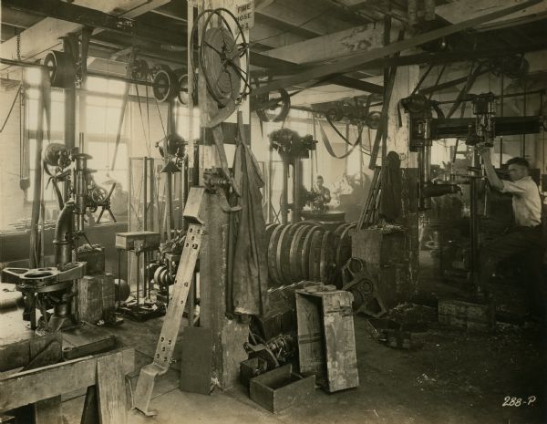 Factory workers in the Tire Mounting Department of the Winther Motor and Truck Company.