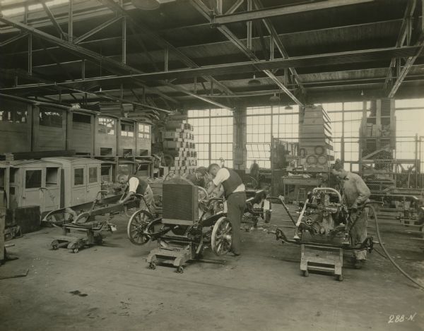 Factory workers in the pleasure car assembly room of the Winther Motor and Truck Company.