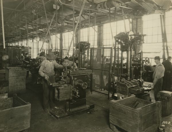 Factory workers in the Machine Shop of the Winther Motor and Truck Company.