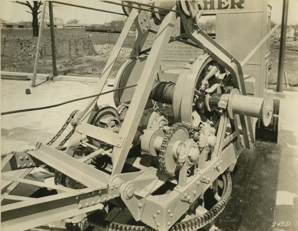 Detail of driving mechanism of a posthole digging machine manufactured by Winther Motor and Truck Company.