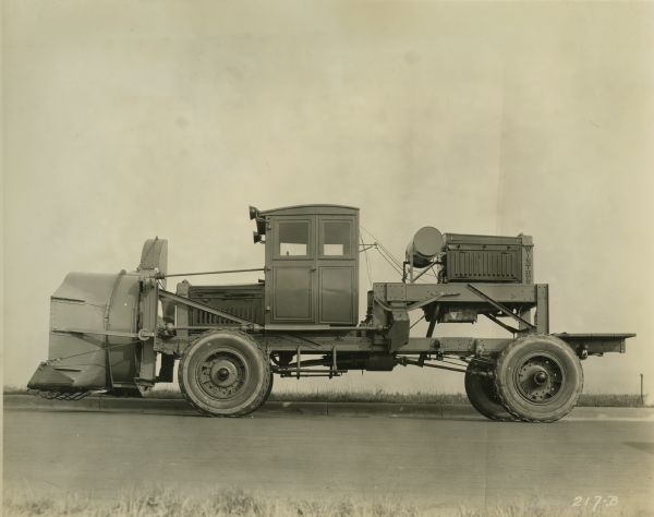 Side view of an early rotary snowplow truck manufactured by the Winther Motor and Truck Company.