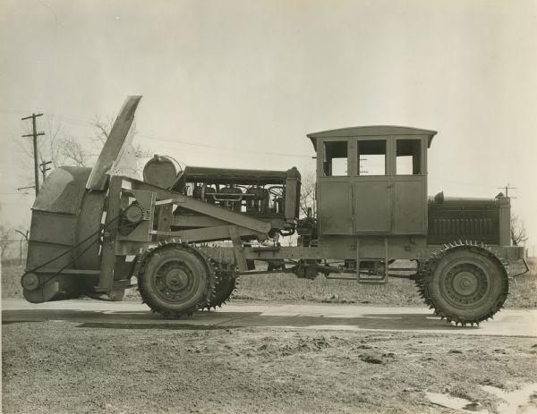 Side view of an early rotary snowplow manufactured by the Winther Motor and Truck Company.