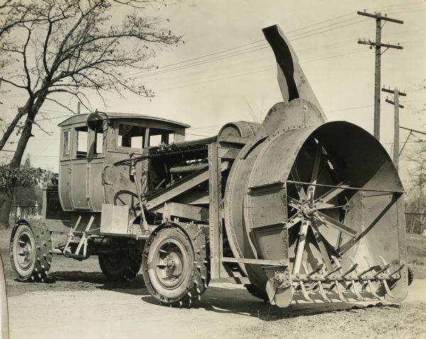 Rotary snowplow with special spiked tires manufactured by the Winther Motors company, with factories in Kenosha, Wisconsin and Winthrop Harbor, Illinois.