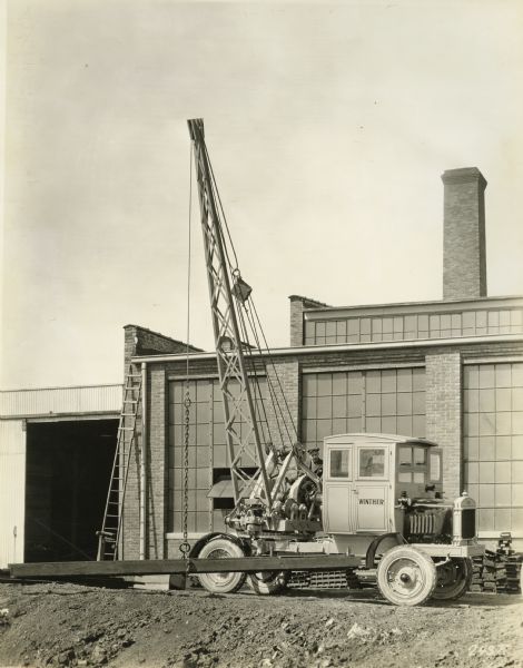 Truck with attached crane manufactured by the Winther Motors Inc., factory.