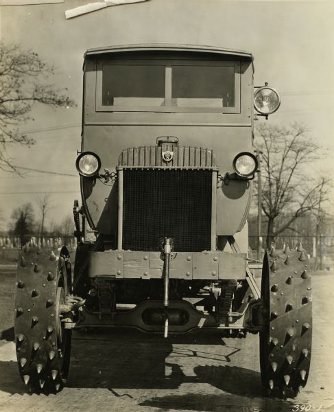 Front view of a snowplow with four wheel drive manufactured by the Winther Motors Inc., factory.