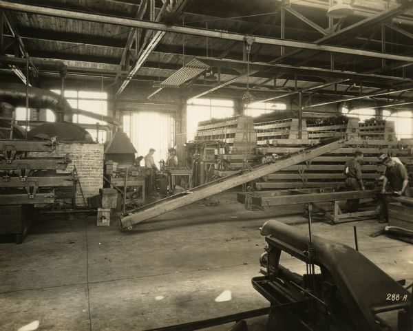 Interior of the Winther Motor and Truck Company factory showing finished truck frames.